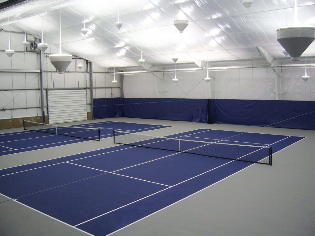 A commercial indoor athletic court featuring blue and white colors.