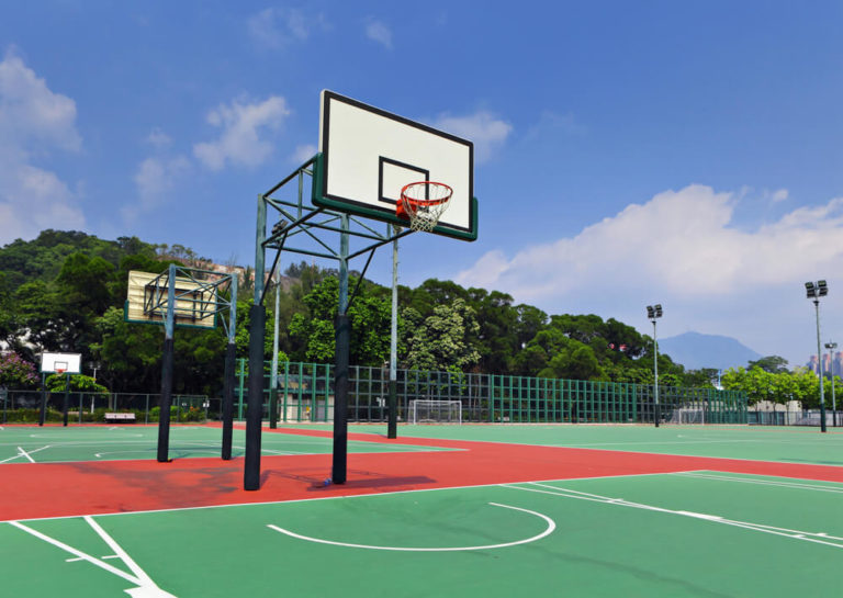 Designing a safe and sunny outdoor basketball court.