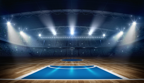 An empty basketball court in Florida with spotlights.